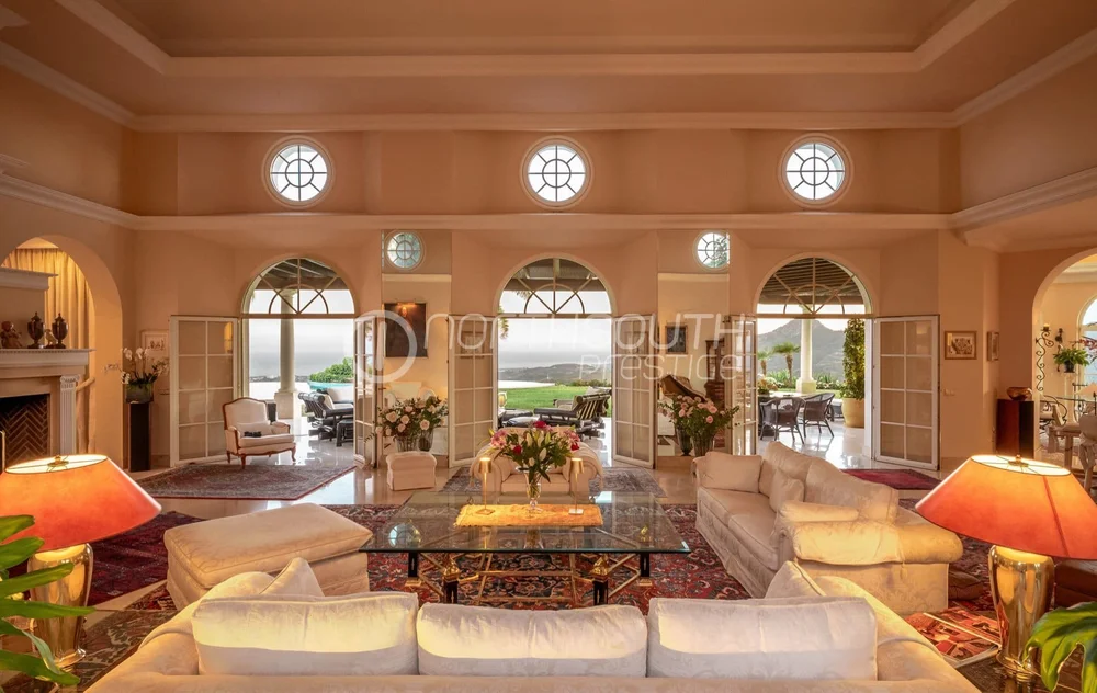 Arched openings connecting the living space to the terrace at the villa.