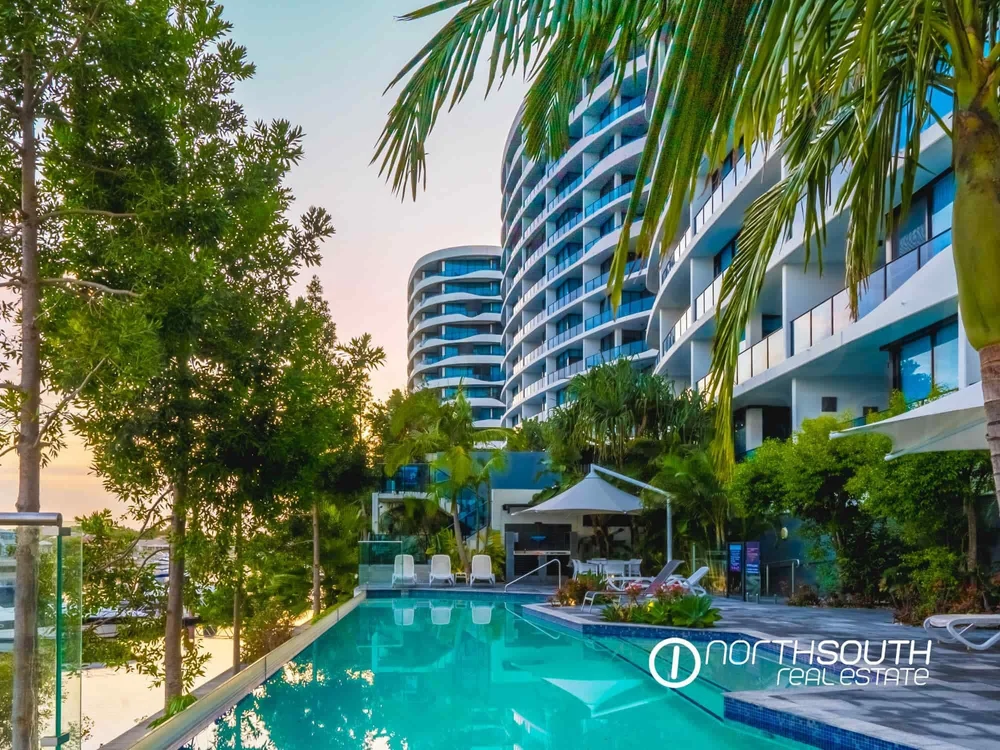 Resort style pool and landscaped gardens at WaterPoint offering lifestyle focused properties for sale in Biggera Waters
