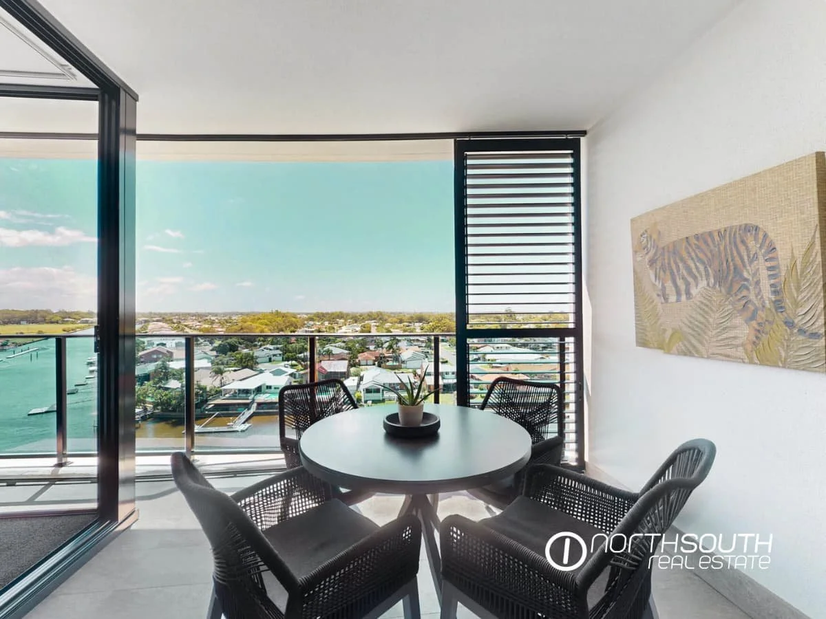 Balcony overlooking canal and greenery at 4705 Waterpoint Residences, Biggera Waters QLD. 
