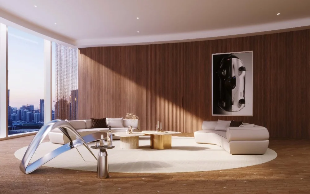 Modern living room with large windows showing city skyline, white curved sofa, gold coffee tables, abstract art on wooden wall, and sleek sculpture in the foreground.