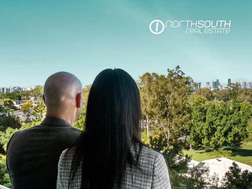 A couple looking at the Gold Coast city skyline views from level 4 of apartment 3409, Waterpoint Residences