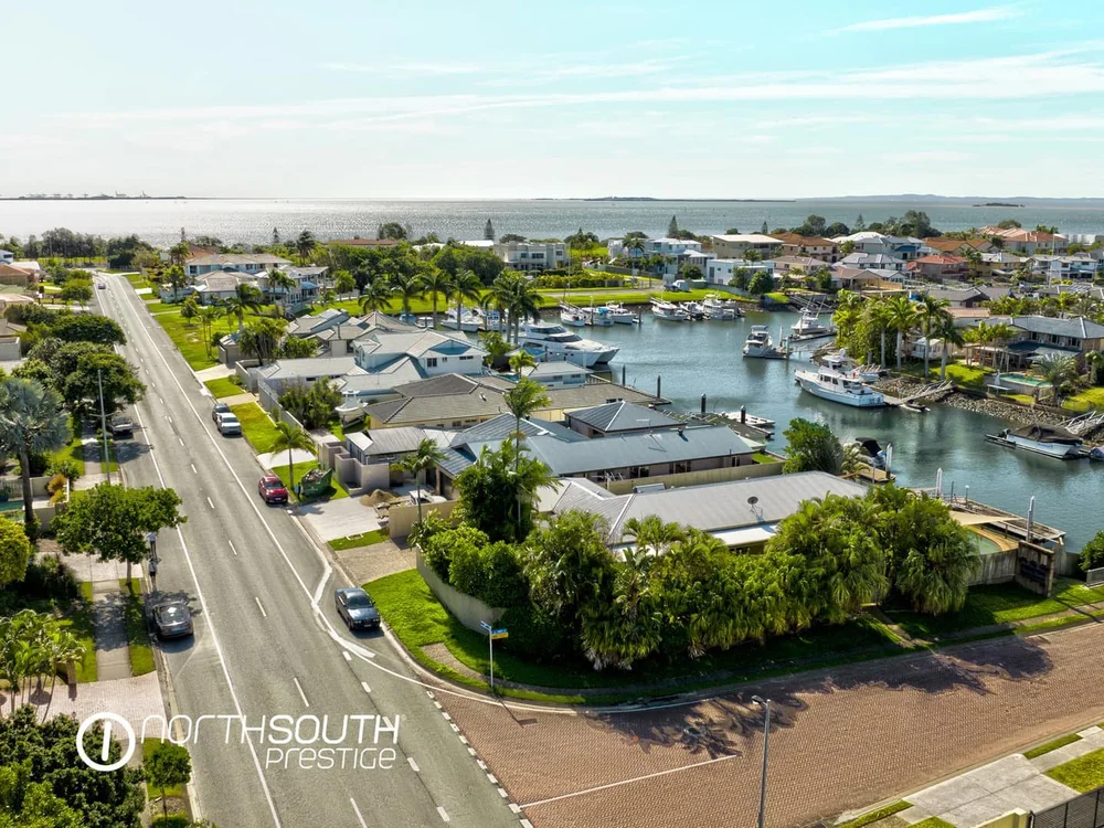 Aerial view of a Brisbane waterfront home, showcasing prestige property opportunities