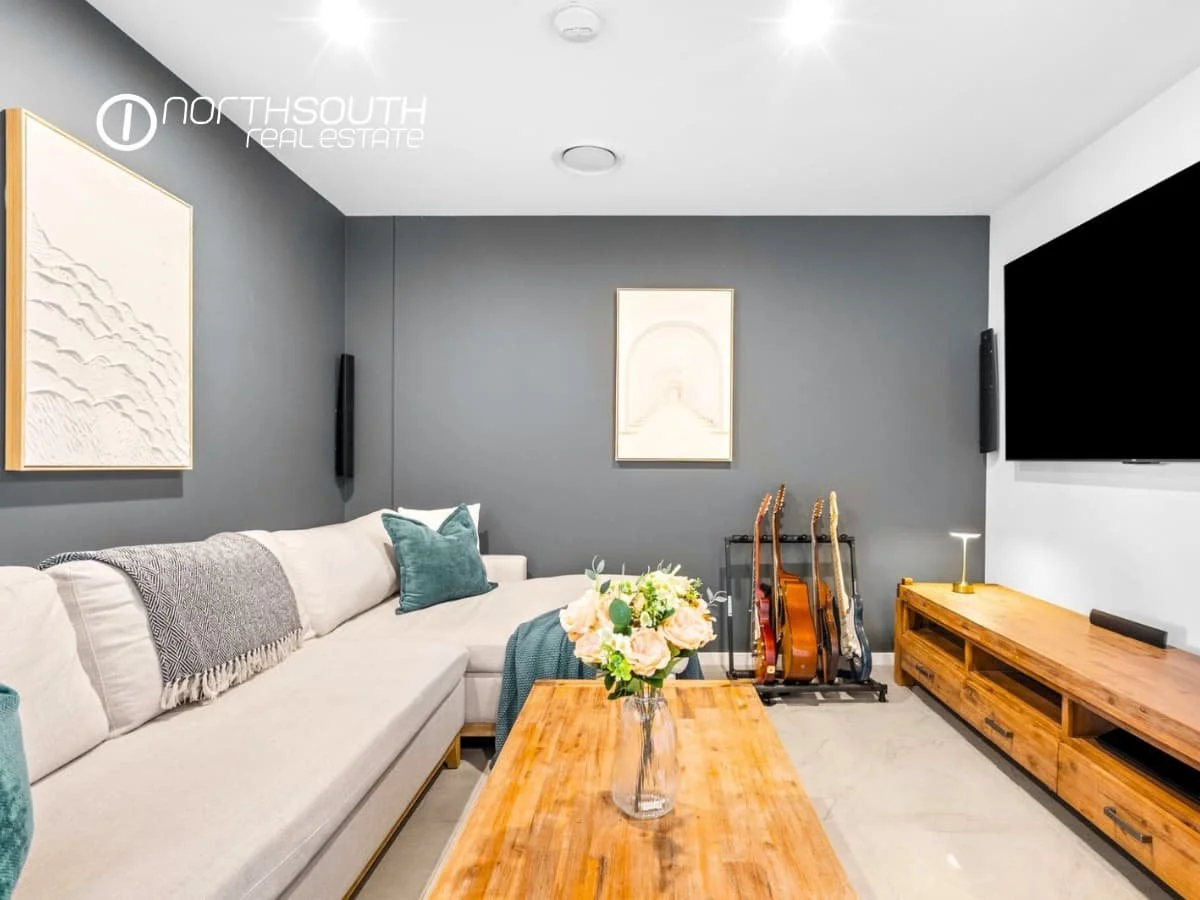 Separate media and Family Room with TV at 51109 Waterpoint Residences, Biggera Waters QLD. 