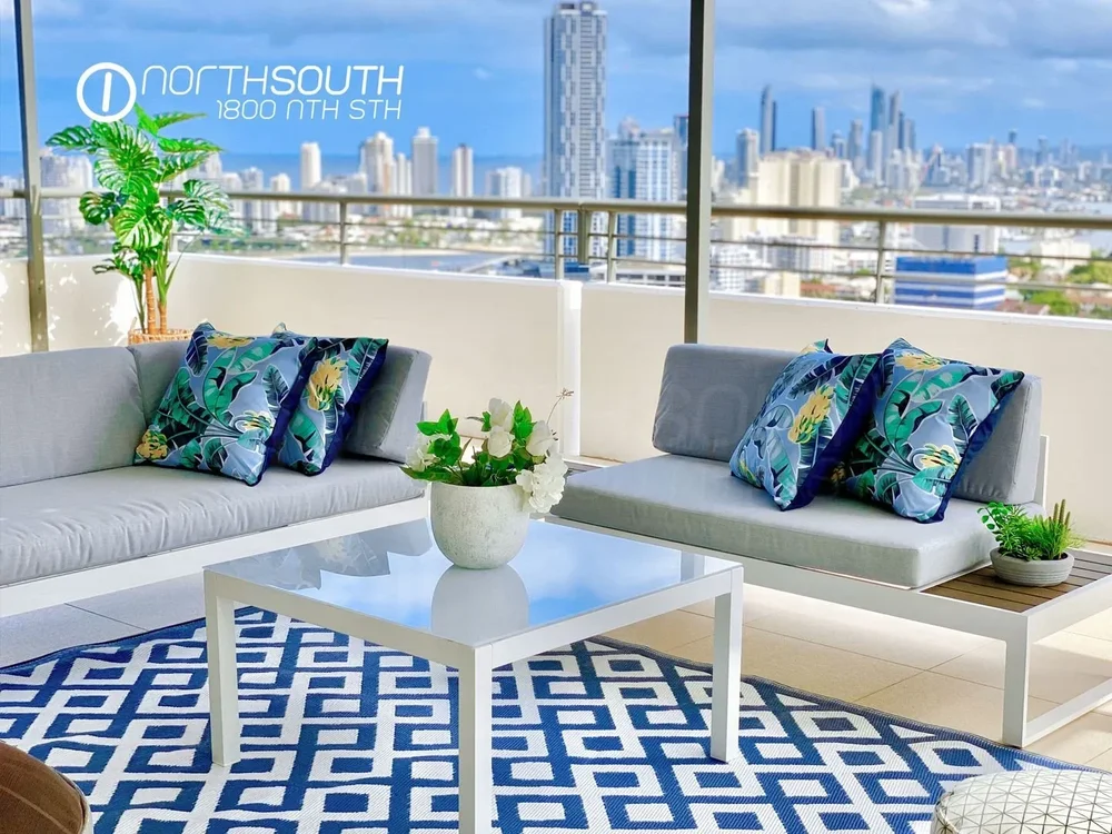 Image of properties for sale gold coast southport apartment penthouse balcony view over city and water.