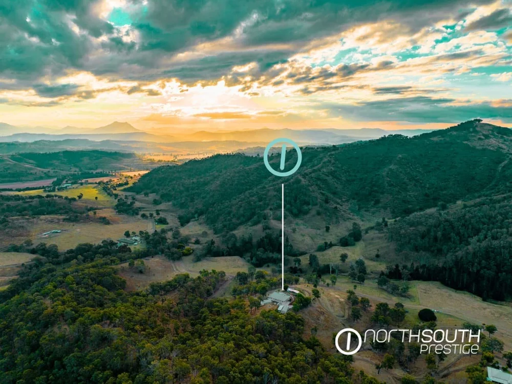 Drone aerial view of the Running Creek rural estate, showing the homestead, gardens and mountain surrounds