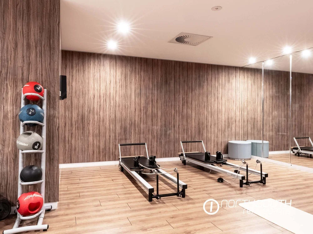 Modern gym with state of the art equipment at WaterPoint Residences offering health focused properties for sale