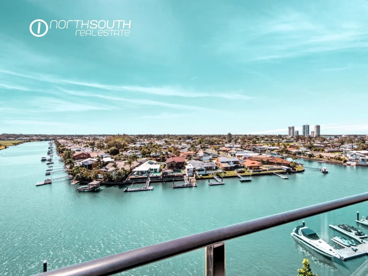 Balcony view overlooking canal and ocean from 4705 Waterpoint Residences, Biggera Waters QLD.