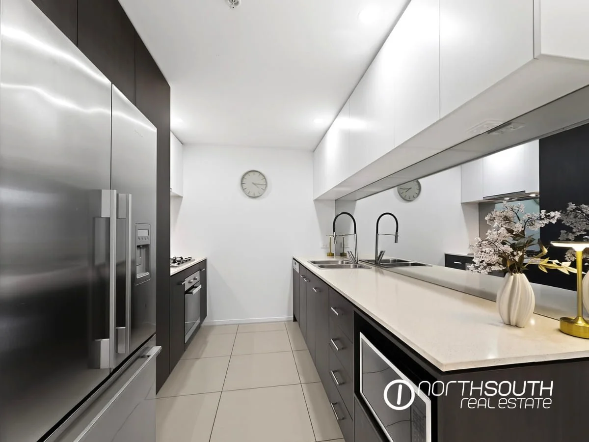 Kitchen with Miele Appliances at fully furnished 2202 25 East Quay Drive Biggera Waters