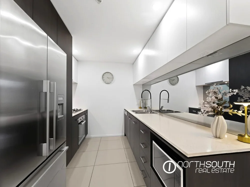 Kitchen with Miele Appliances at fully furnished 2202 25 East Quay Drive Biggera Waters