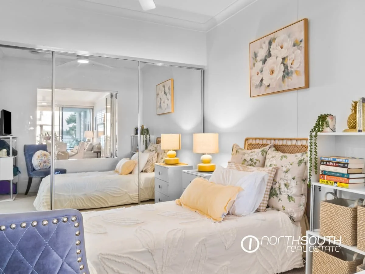 Guest nedroom with storage and built-in-robe at 301 41 Harbour Town Drive Biggera Waters