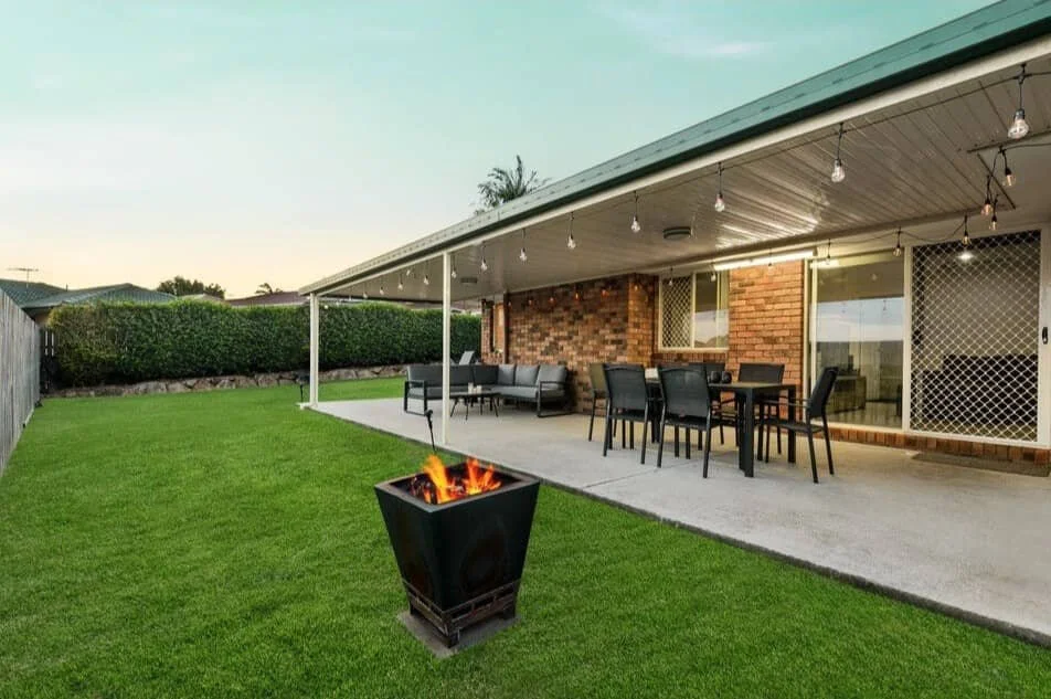 Covered outdoor entertaining area with alfresco dining and fire pit at 13 Turquoise Crescent Griffin secured through professional buyer advocacy.