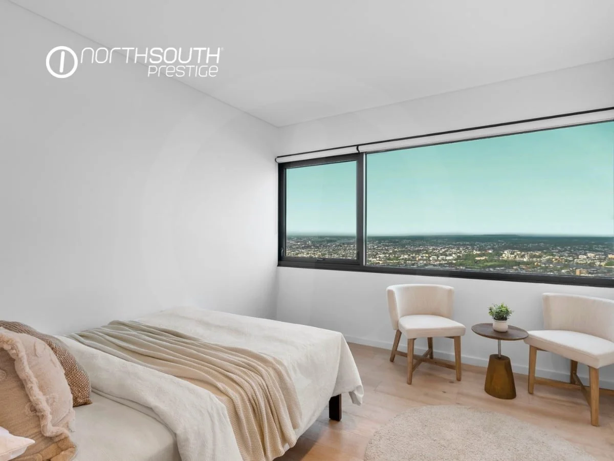 Second bedroom with a reading area and Brisbane views - properties for sale Riparian Plaza apartment 4903 