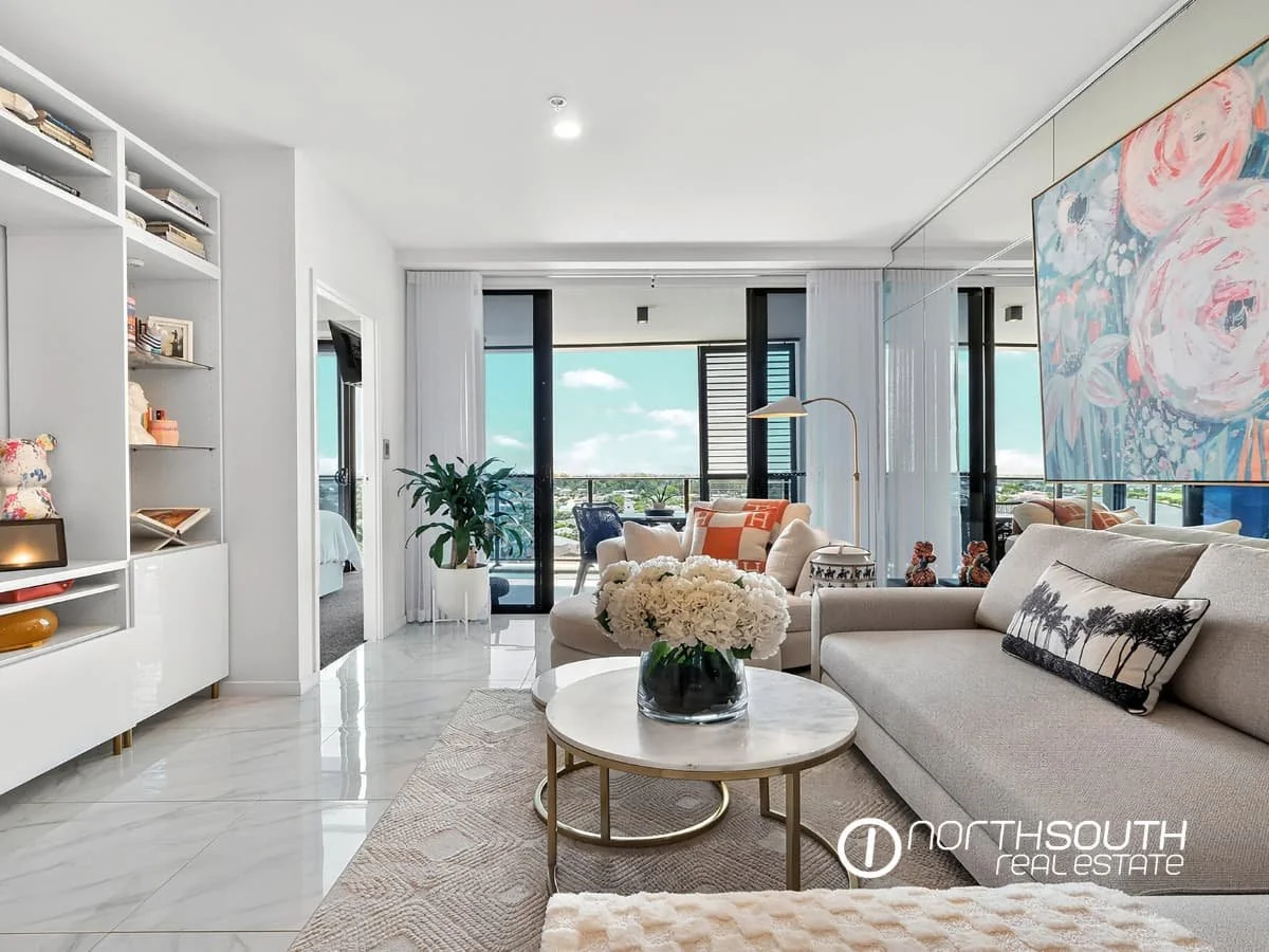 Spacious living and dining zone with balcony access at 4705 Waterpoint Residences, Biggera Waters QLD. 