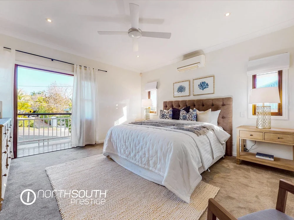 Image of properties for sale Brisbane in Bardon master bedroom with wardrobe and balcony access.