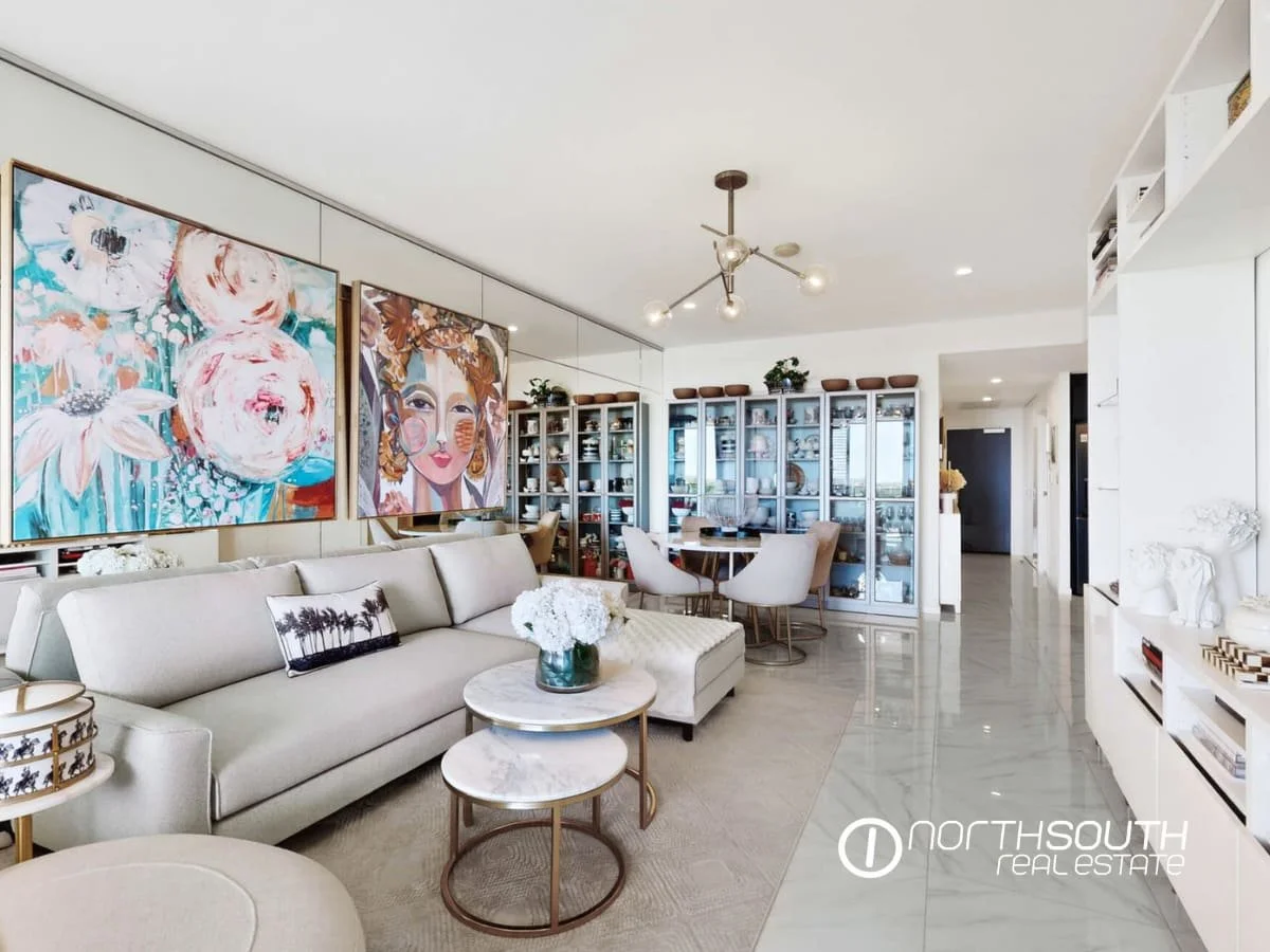 Open-plan living and dining area with tiled floors at 4705 Waterpoint Residences, Biggera Waters QLD.