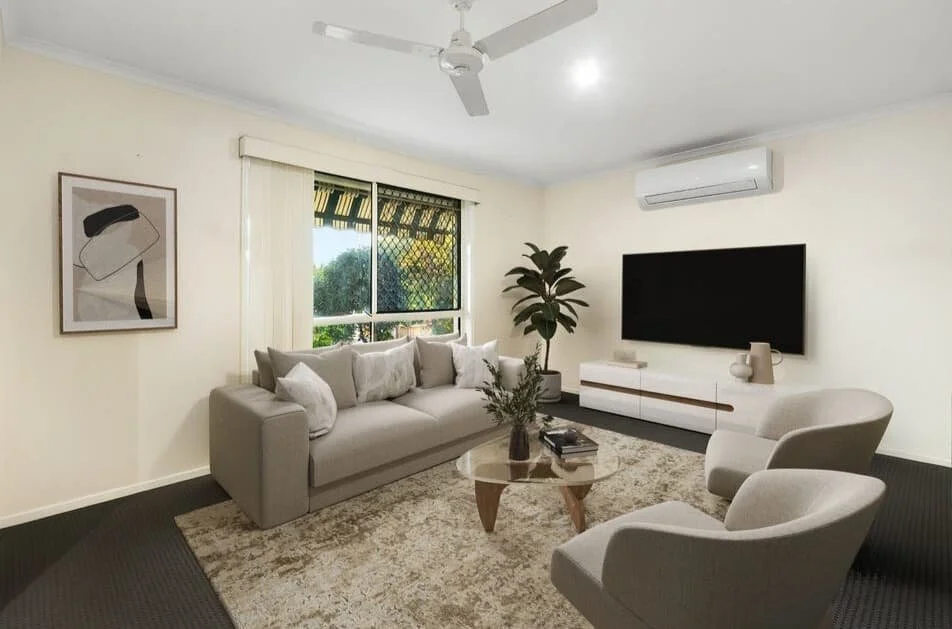 Comfortable living room with sofa seating, wall mounted TV, ceiling fan and natural light at 13 Turquoise Crescent Griffin.