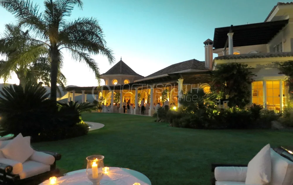 Evening lighting across the covered terrace at the villa.