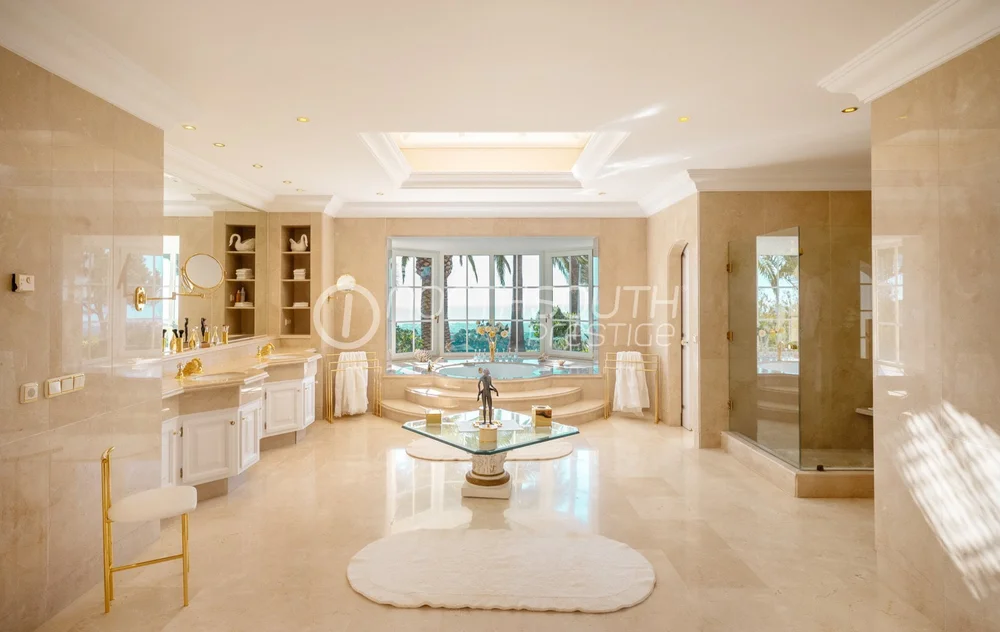 Master ensuite in villa in Marbella Spain with large windows capturing beautiful sea views.