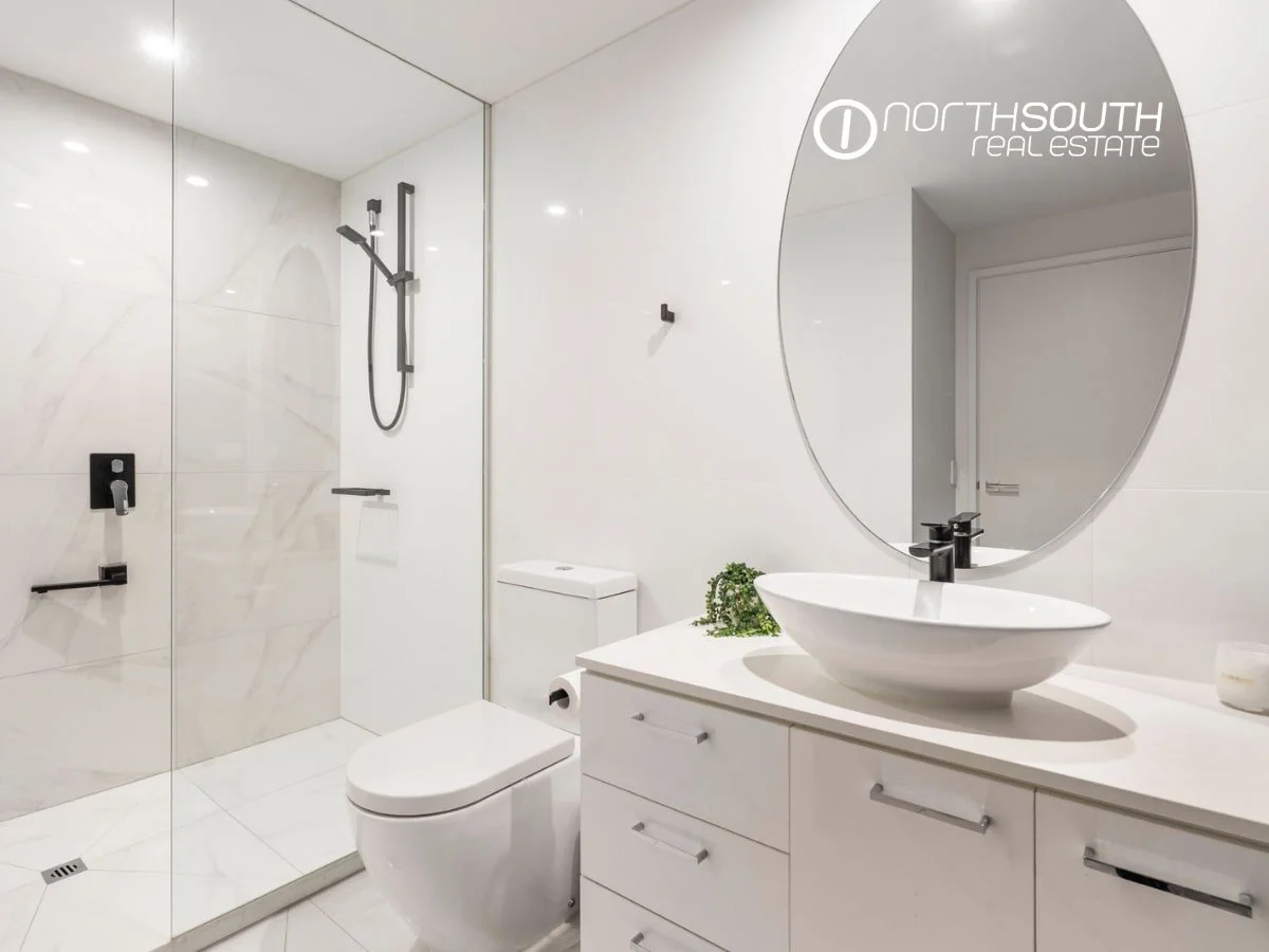 Second bathroom with glass shower and tiled floors at 3303/5 Harbourside Ct Waterpoint Residences, Biggera Waters QLD.