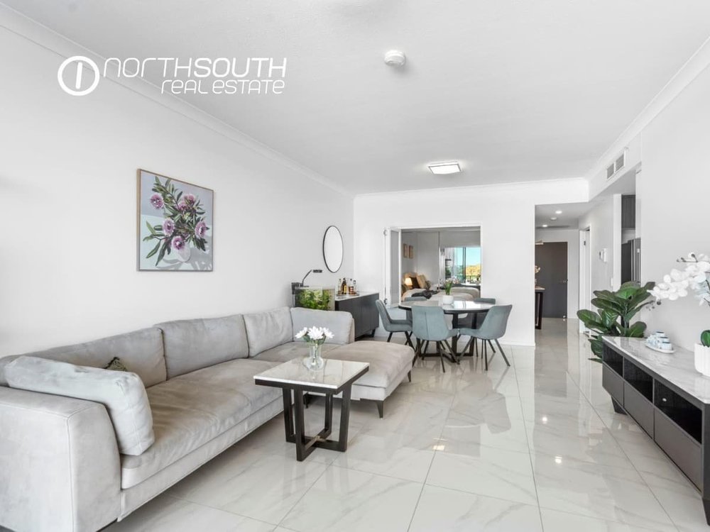 Spacious living and dining zone with tiled floors at apartment 3409, Waterpoint Residences