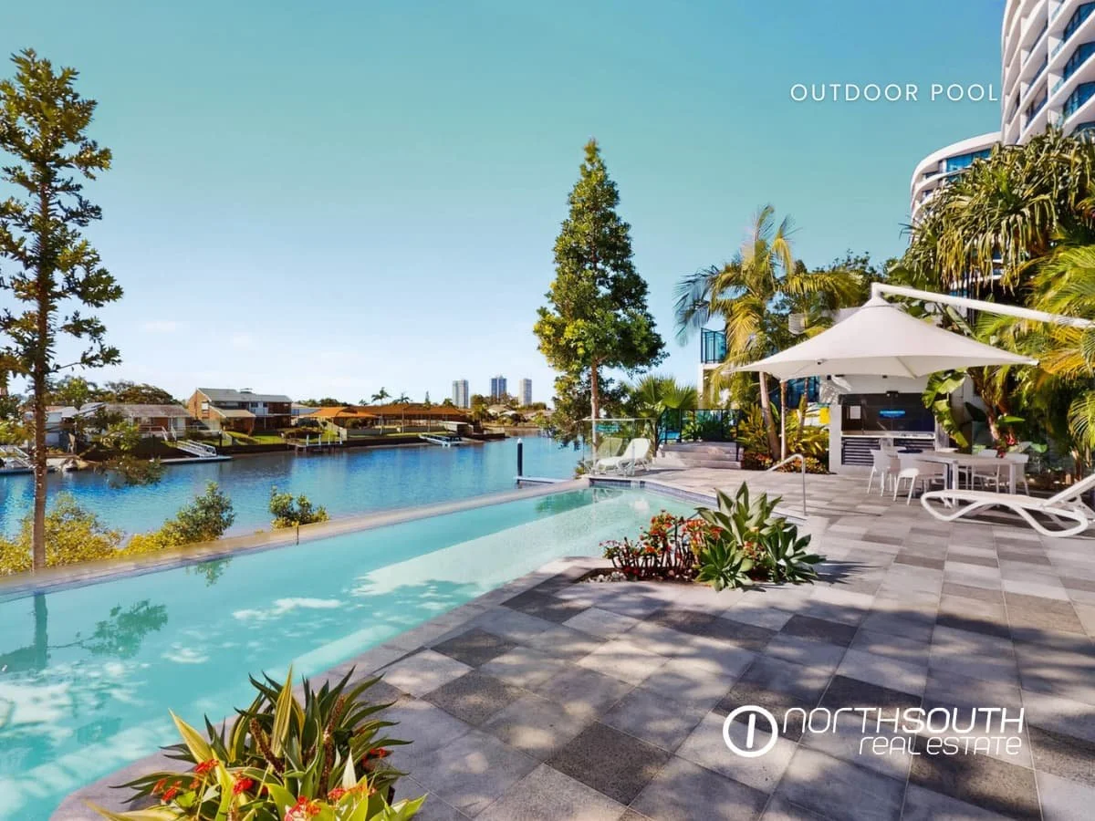 Outdoor pool and Canal Views from Waterpoint Residences, Biggera Waters QLD. 
