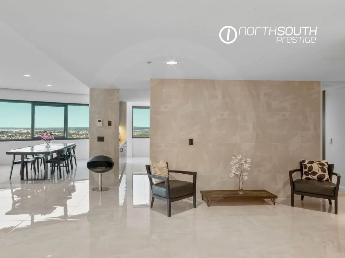 Foyer wuth tiled flooring and tiled walls flowing into living and dining area including kitchen - Brisbane properties for sale Riparian Plaza apartment 4903 