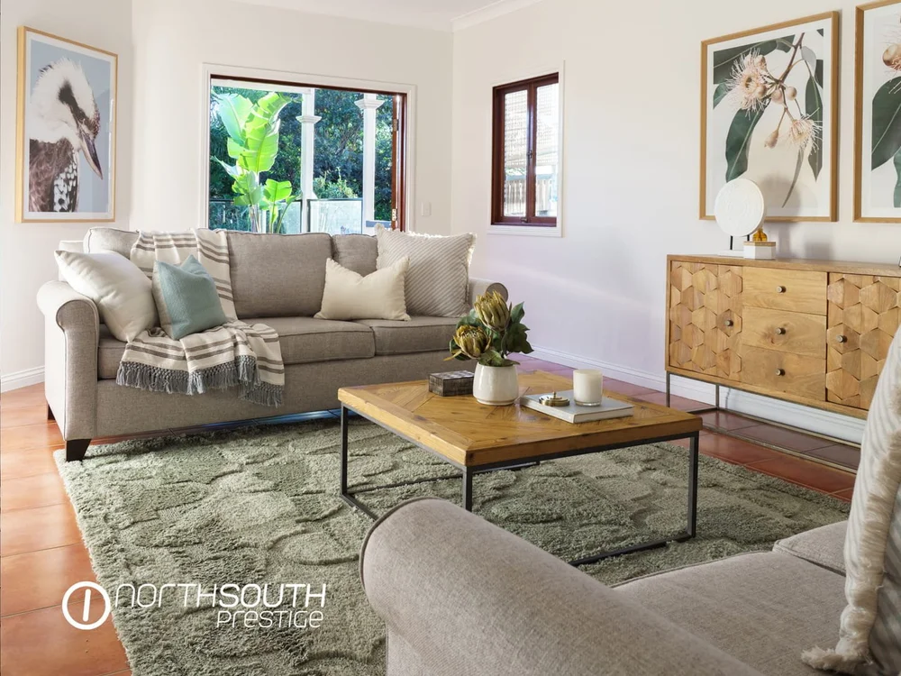 Image of properties for sale Brisbane in Bardon lounge room with seating area and feature finishes.