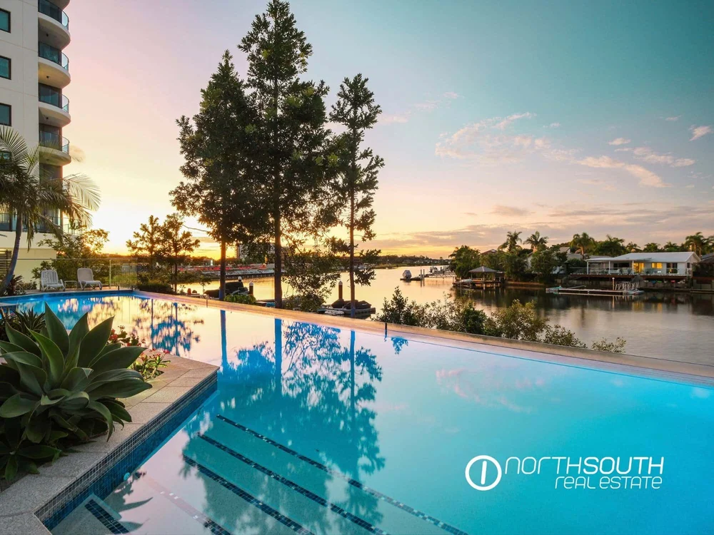 Poolside leisure area in properties for sale at Harbourside Biggera Waters offering resort-style living