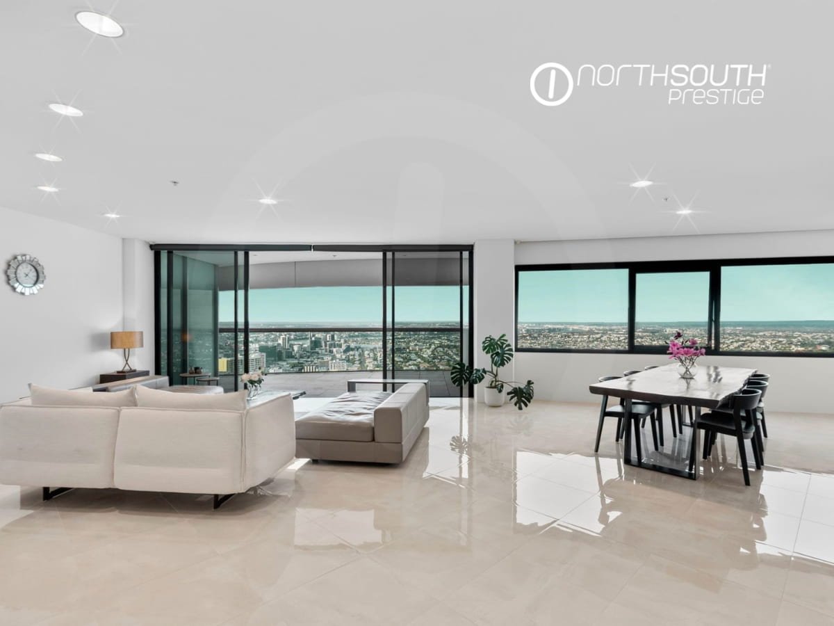 Living and Dining area with tiled floors and city views from balcony - Brisbane properties for sale Riparian Plaza apartment 4903 