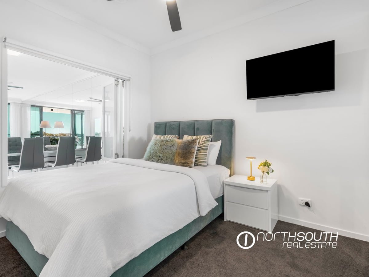 Second bedroom with window and natural light, in-build wardrobe at 3303/5 Harbourside Ct Waterpoint Residences, Biggera Waters QLD.
