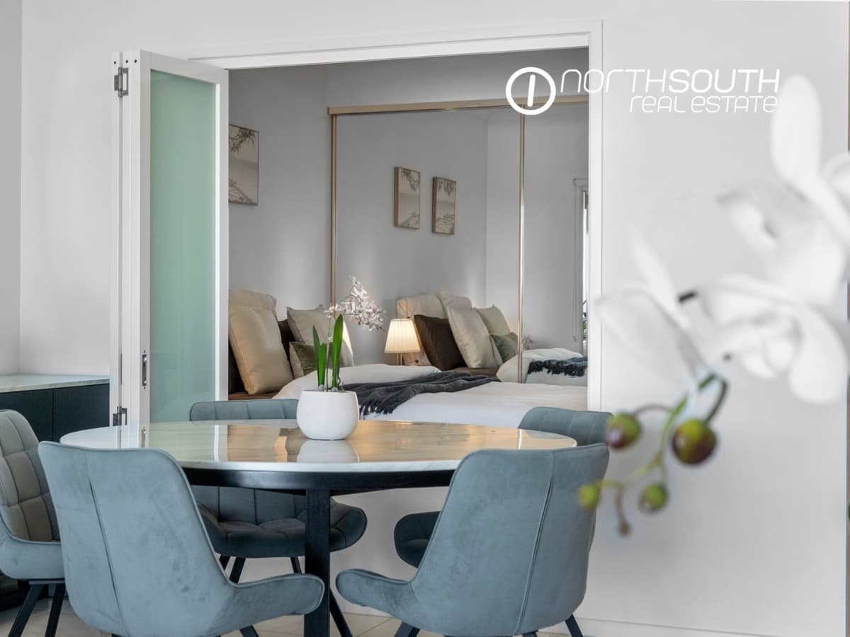 Dining area overlooking the second bedroom at 3409/5 Harbourside Ct Waterpoint Residences, Biggera Waters QLD. 