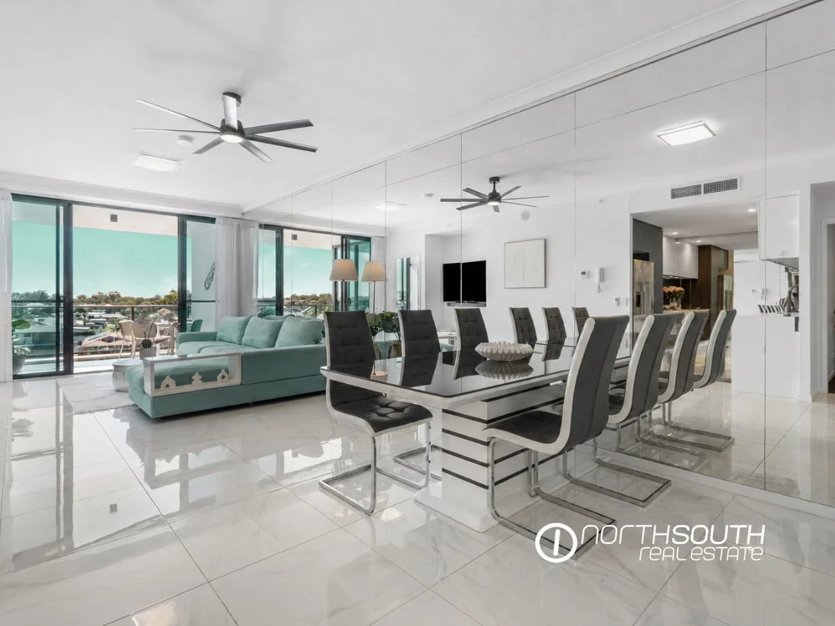 Spacious living and dining zone with tiled floors flowing to balcony at 3303 5 Harbourside Ct Waterpoint Residences, Biggera Waters QLD. 