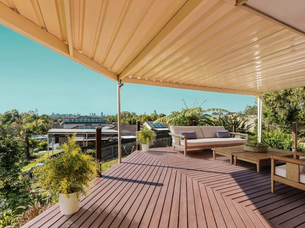 Covered timber deck with outdoor seating and treetop outlook, included in a home purchased through buyers advocacy. Parkwood, Gold Coast, Qld.