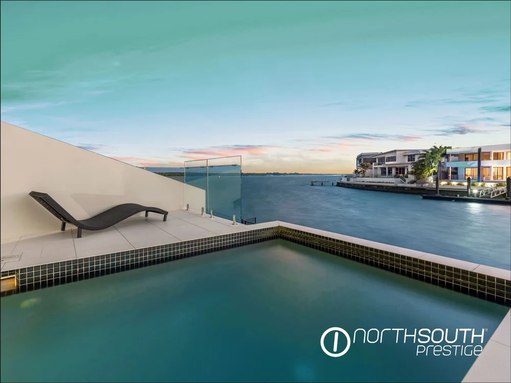 Pool overlooking the waterway at a Sovereign Islands waterfront home