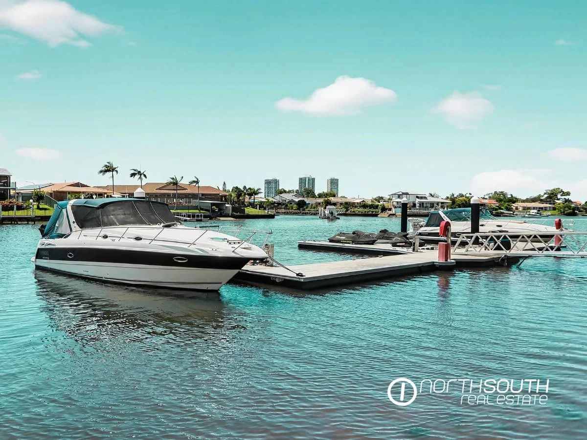 Boats along the canal walk at Waterpoint Residences, Biggera Waters QLD. 