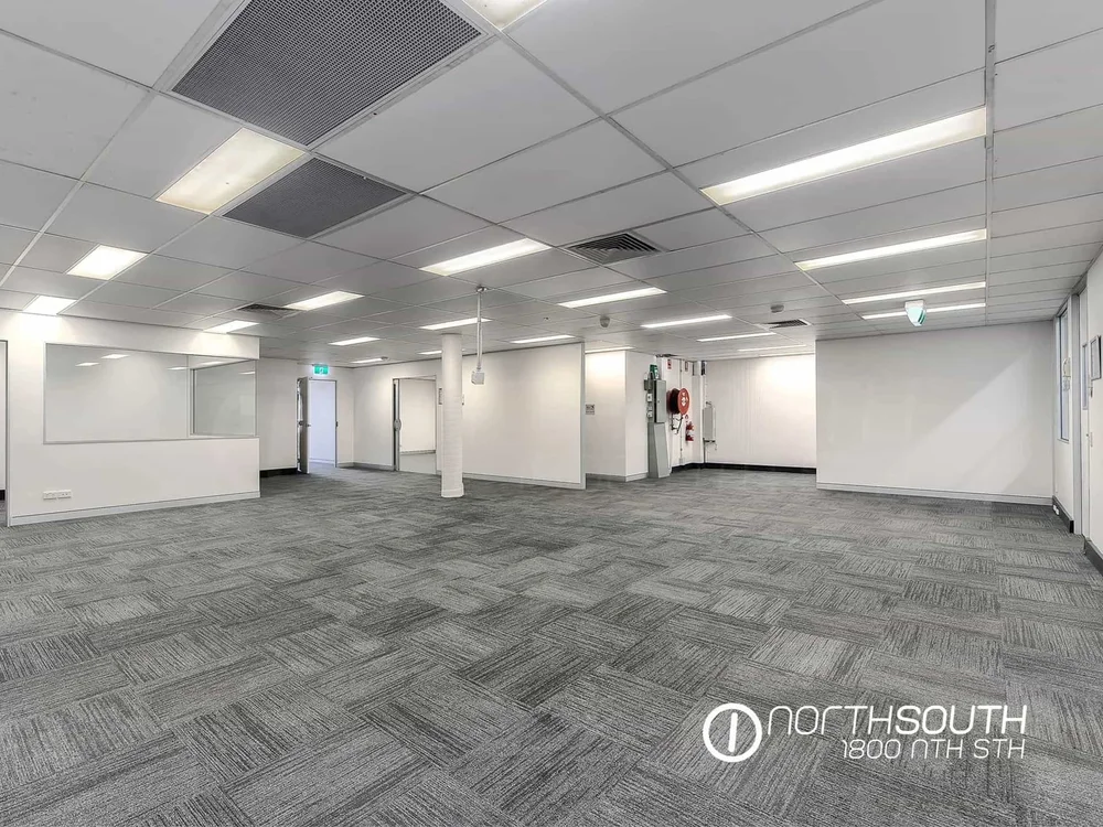 Image of brisbane commercial property for sale partitioned offices and meeting rooms on upper level.