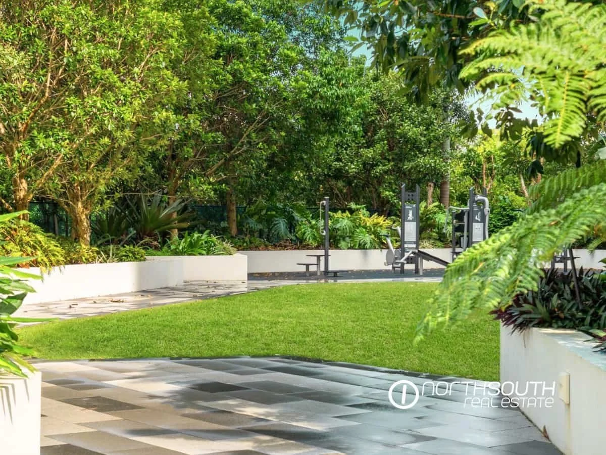 Outdoor gym and green grass at the entertainment area of Waterpoint Residences, Biggera Waters QLD.
