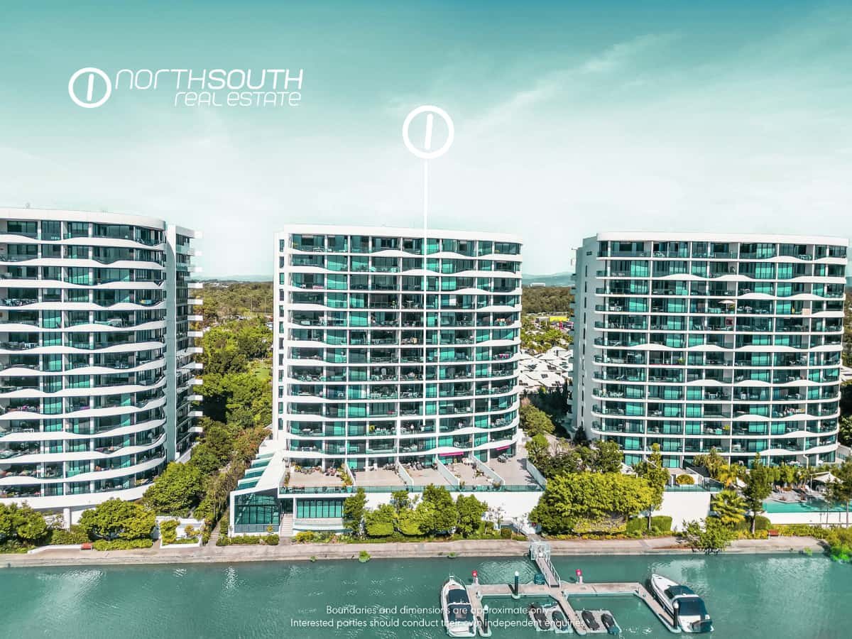 Aerial view of Waterpoint Residences in Biggera Waters  with canal views and boats