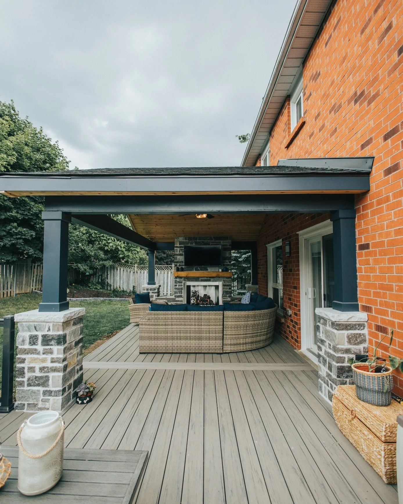 covered porch with outdoor fireplace