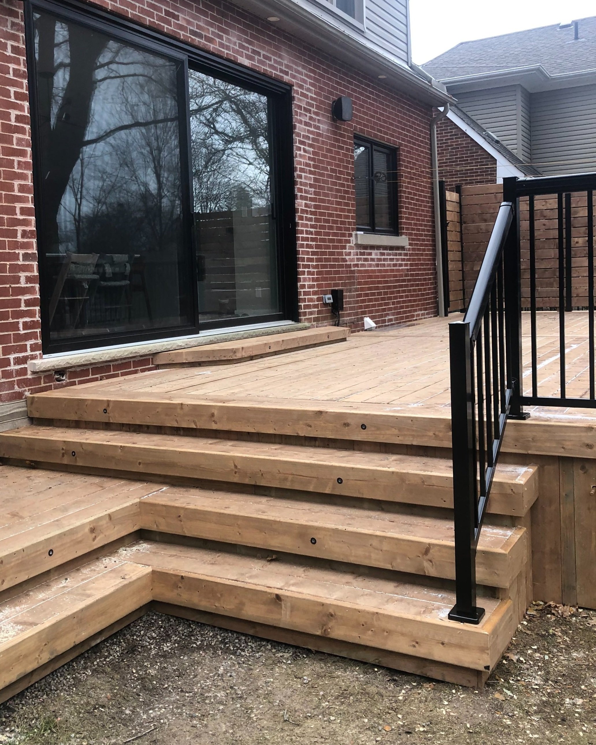 tiered wood staircase to raised deck