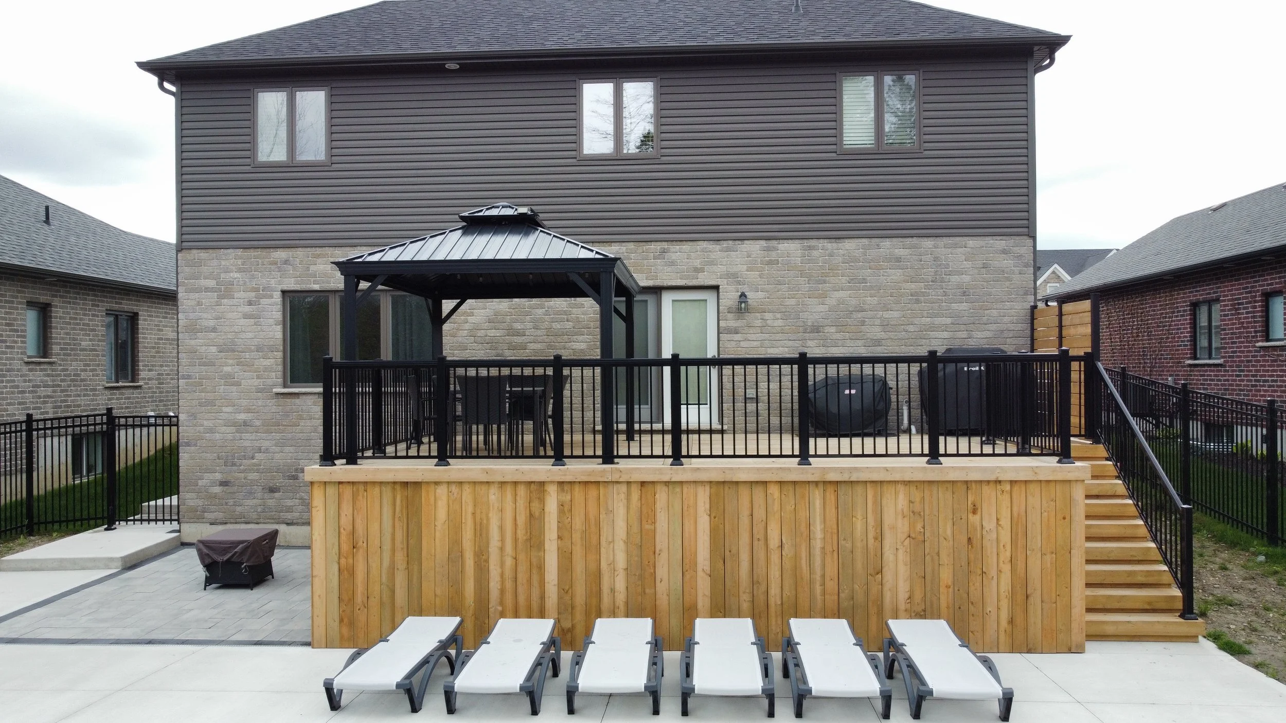 Pressure Treated Deck with Aluminum Railings located in Listowel Ontario