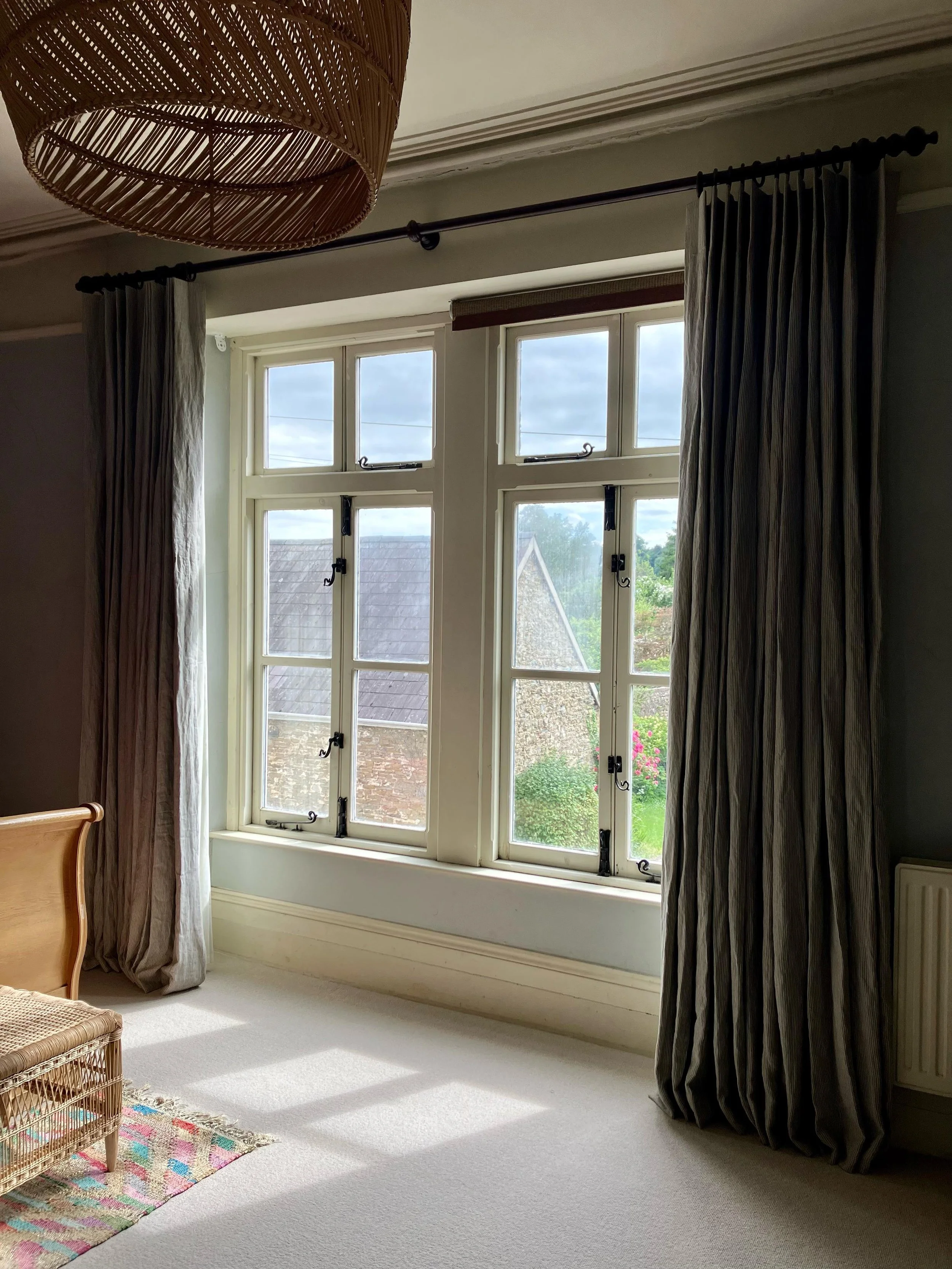 It&rsquo;s delightful to see these up! They&rsquo;re rather tall and add a real elegance to this already lovely room. Gorgeous soft wobbly striped linen in a green shade. The client went for a flat pleat/single pleat to keep the look simple which rea