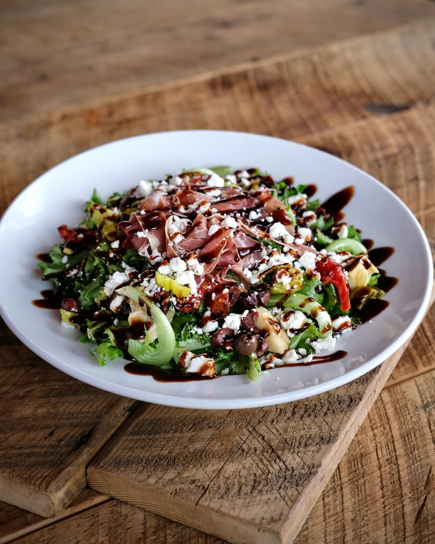 Good day for something a little lighter. Our Spring Seasonal Antipasto Salad hits the spot.

Little leaf lettuce topped with fire-roasted tomato, Kalamata olive, feta cheese, artichoke heart, pepperoncini and prosciutto. Drizzled with a balsamic glaz