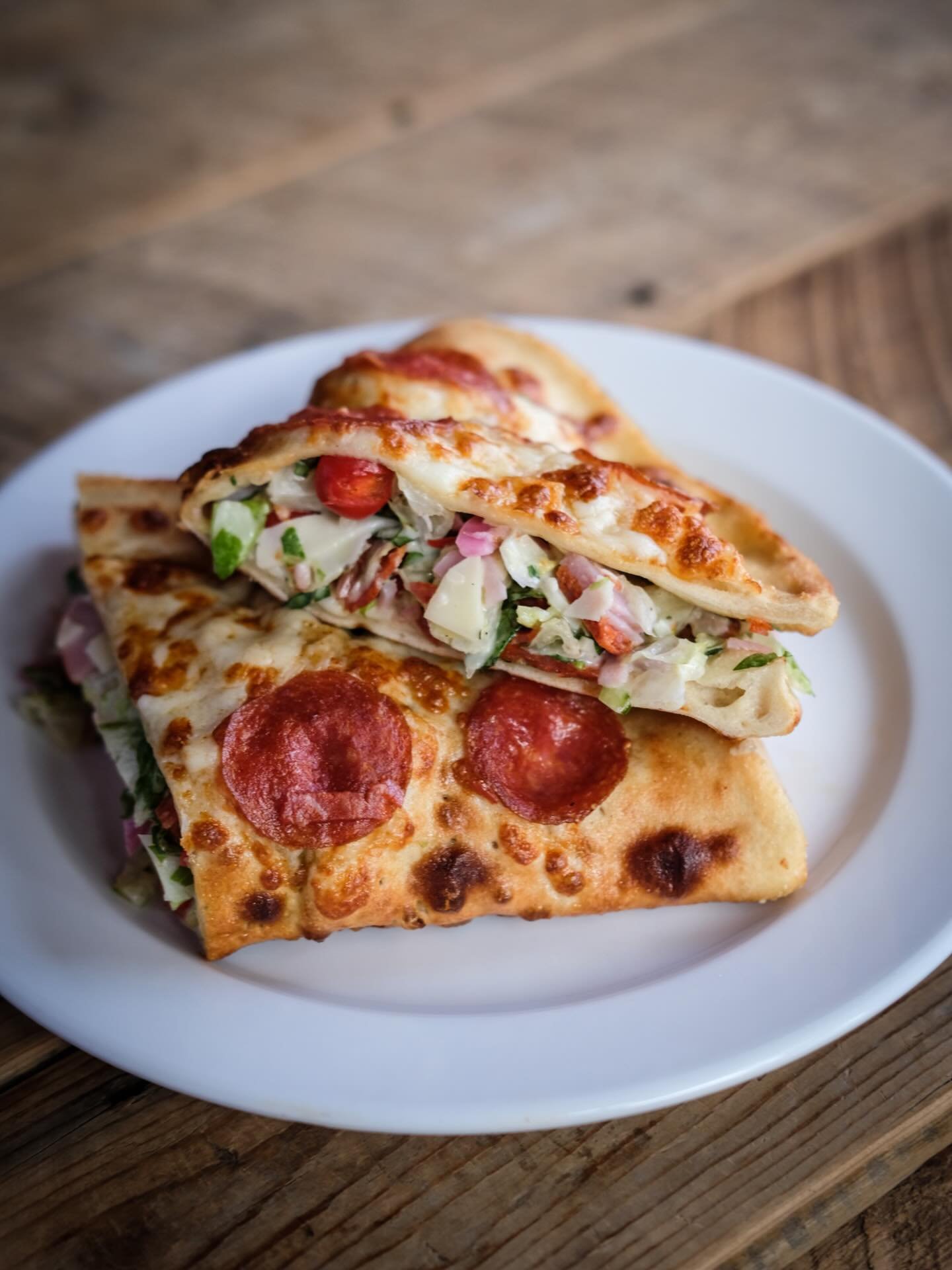 Our NEW Italian Chop &lsquo;Sal-Zone&rdquo; is here!

Our garlic dough folded and baked with a three-cheese blend and crispy pepperoni. Stuffed with chilled Italian chop salad tossed in a creamy Italian dressing.

Grab one today! Part of our new Wint