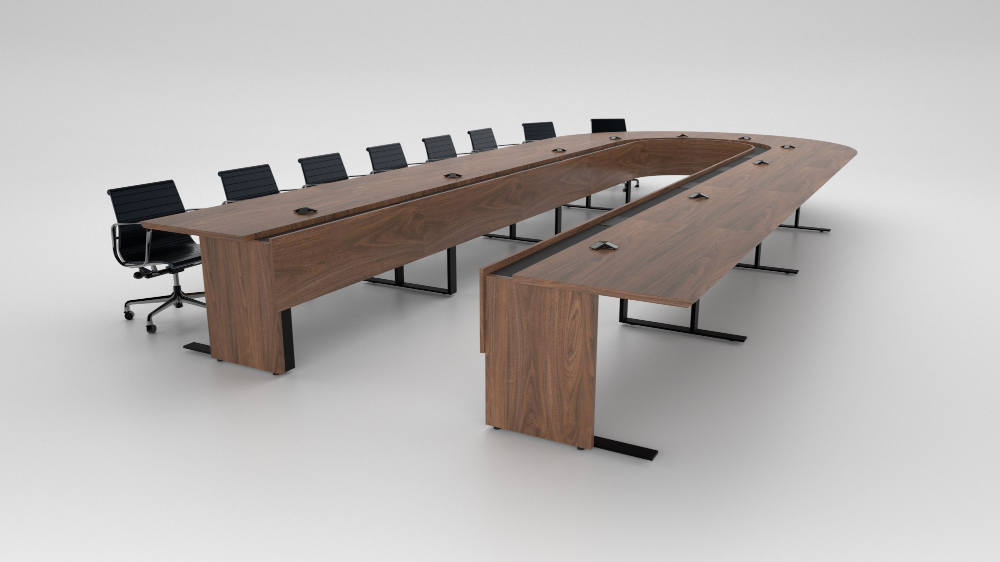 Cornerstone Furniture built a custom boardroom table for a U.S. Army base in Germany. Featuring a U-shaped design in walnut veneer, a lowered power and data trough, modesty panels, and custom bases with wire management access for clean functionality.