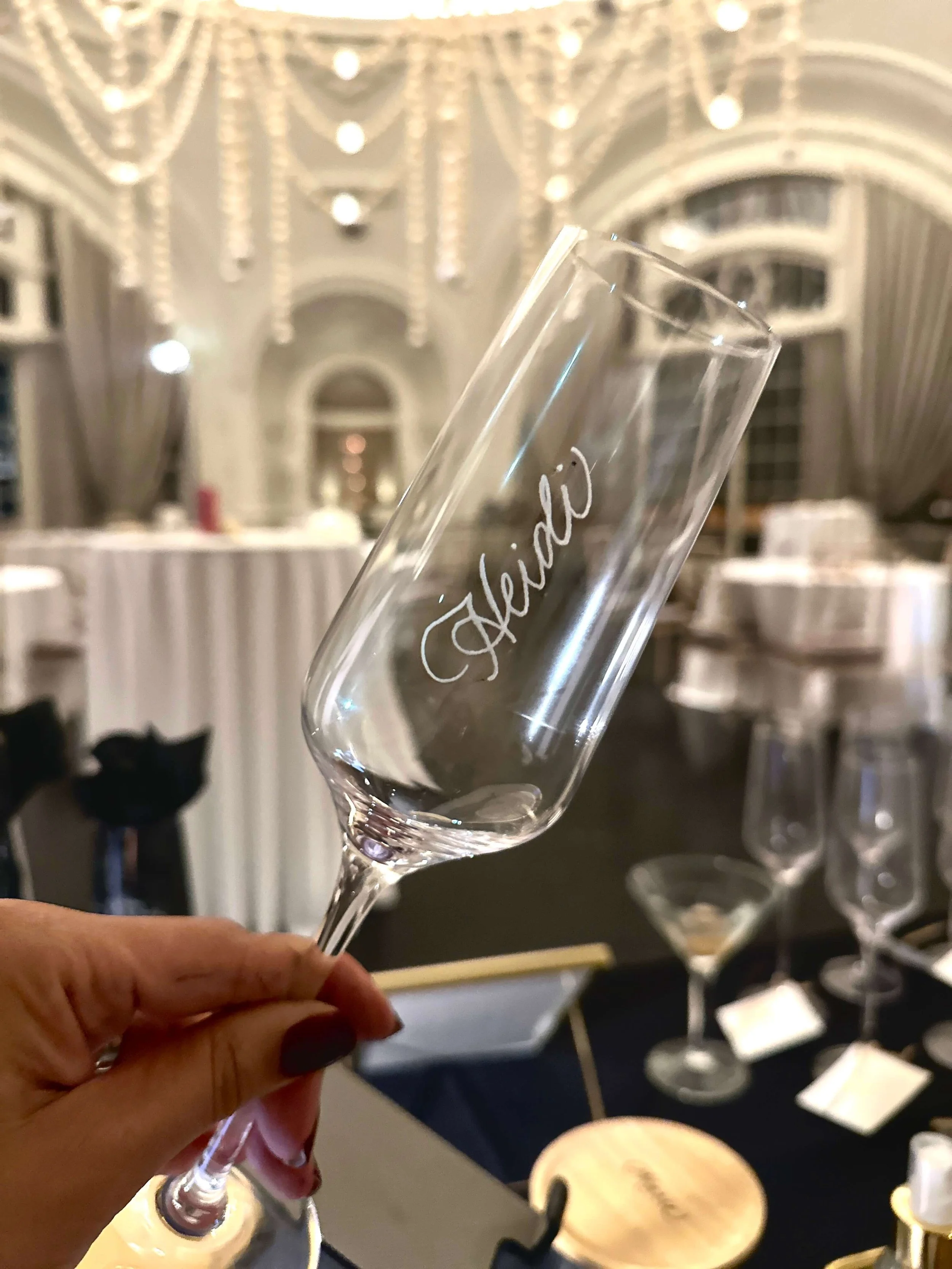 Champagne flute with the name Heidi engraved longways