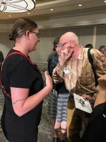 Julessa Scofield discussing her metalsmithing work with Foldforming pioneer Charles Lewton-Brain at the Society of North American Goldsmiths (SNAG) conference