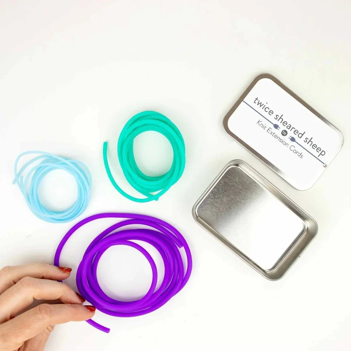 knit extension cords in purple, teal, and light blue from Twice Sheared Sheep