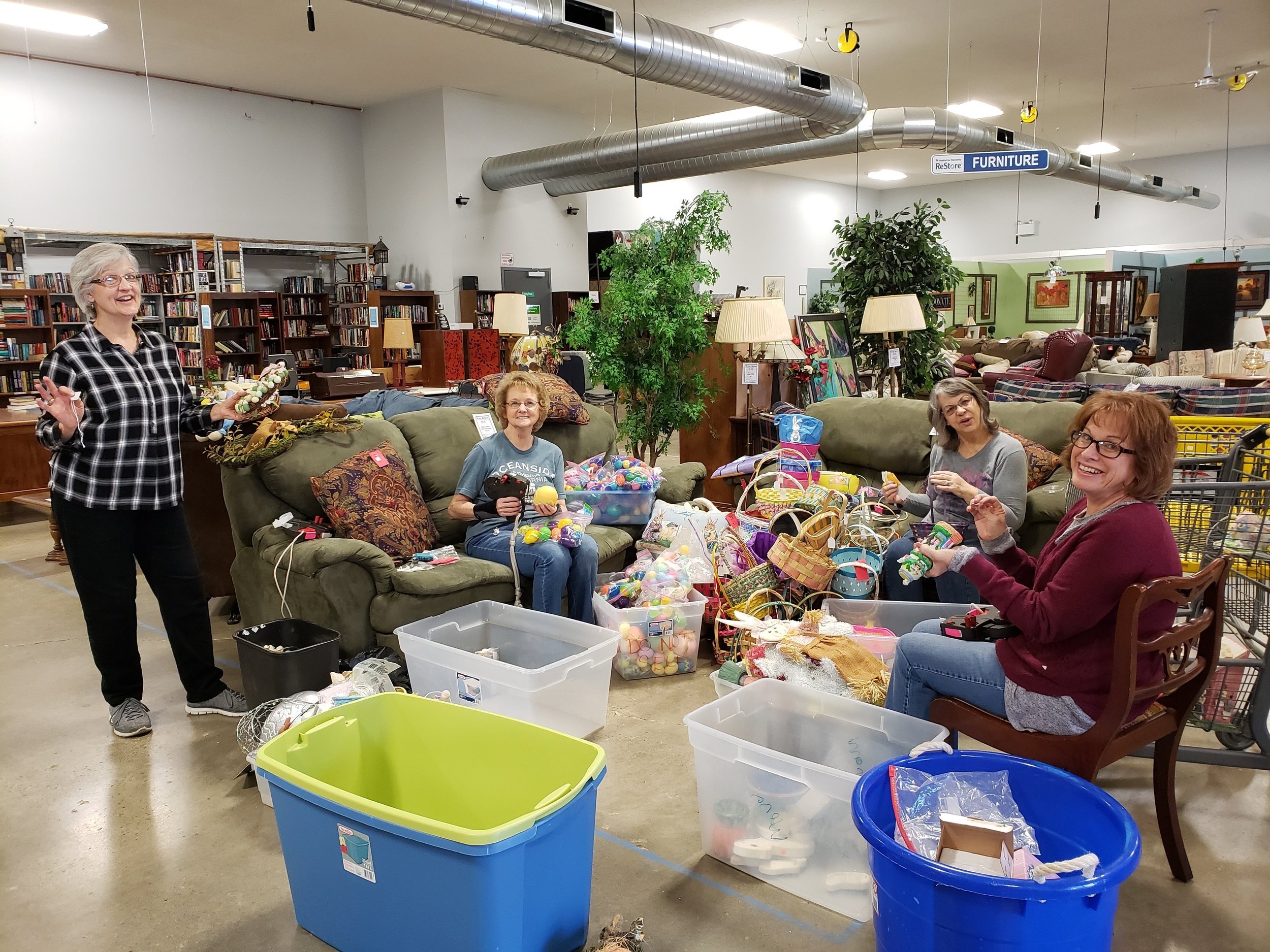 ReStore volunteers sorting and pricing items for the sales floor