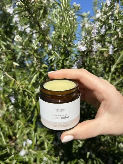 Handmade beeswax body balm by Cuckmere Organics in an amber glass jar